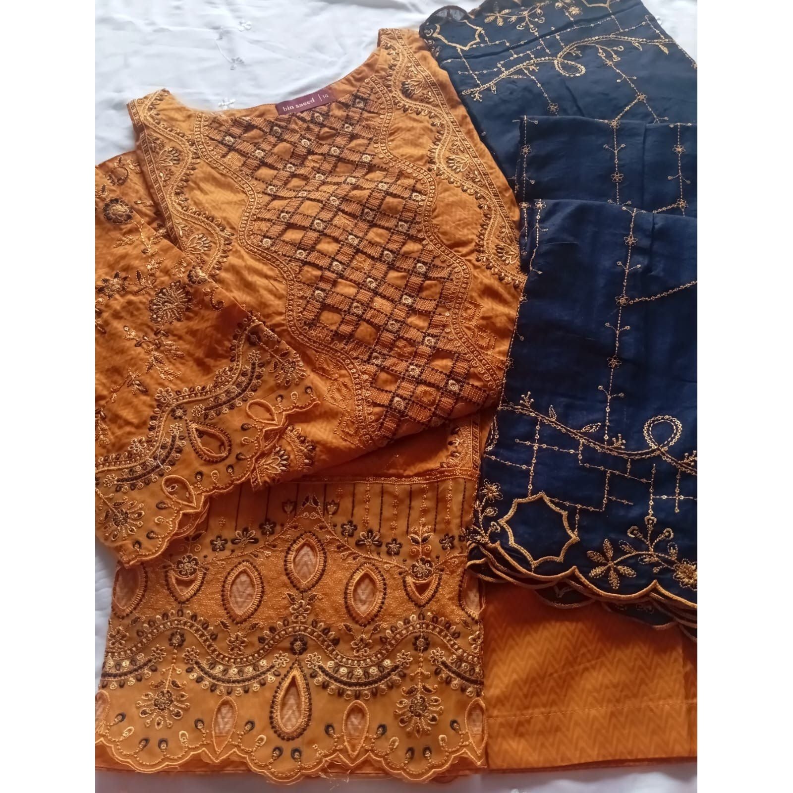 • Clothing: Embroidered/Printed suit for women - Made of best quality fabric - lawn or linen or chiffon - pure silk - Available at Najma Designs & Co. • Jewelry: Gold - plated stud earrings for