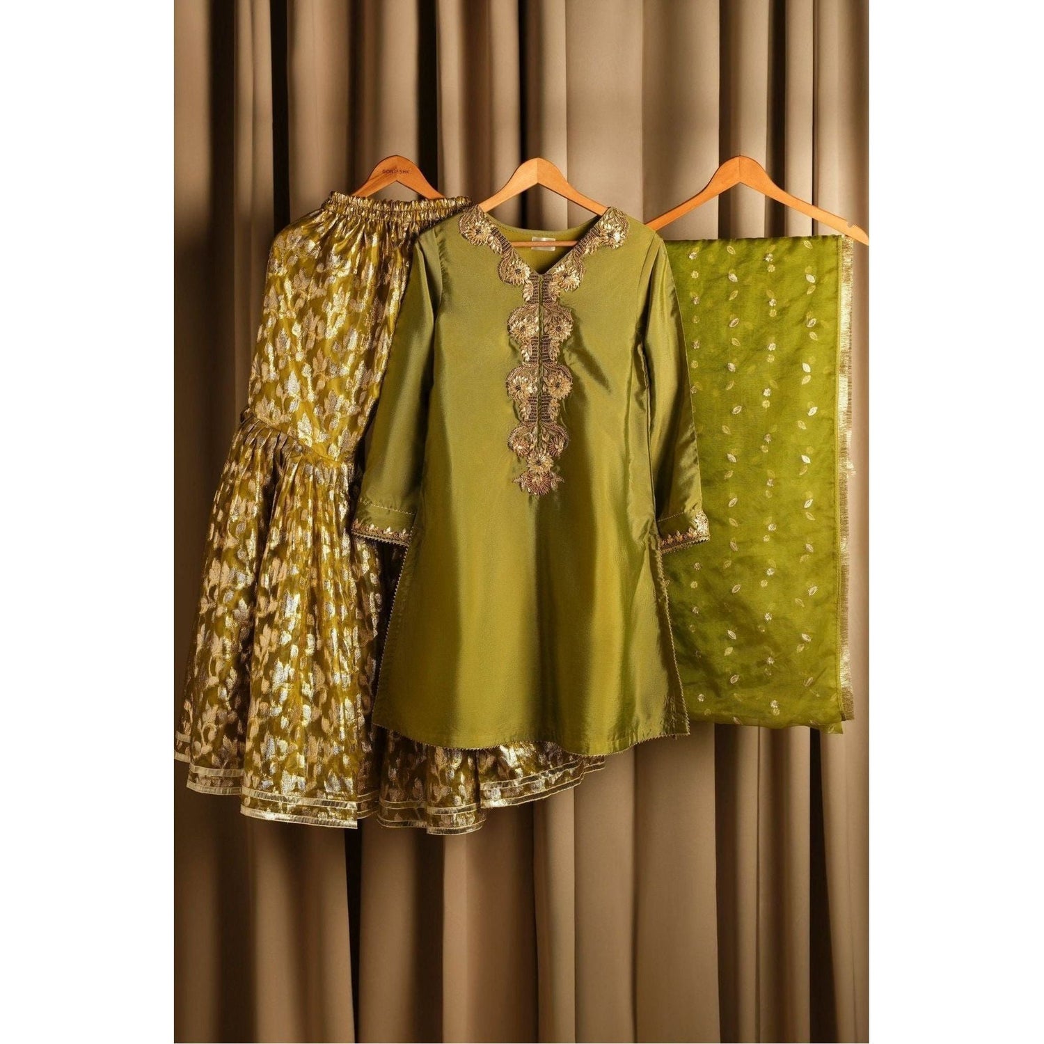 Mehndi-colored silk hand-embroidered gota gharara suit with crystal work.