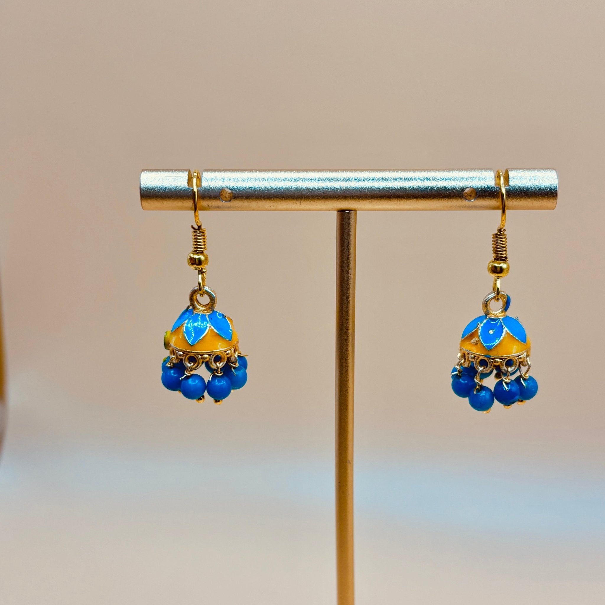 • Clothing: Embroidered/Printed suit for women - Made of best quality fabric - lawn or linen or chiffon - pure silk - Available at Najma Designs & Co. • Jewelry: Gold - plated stud earrings for