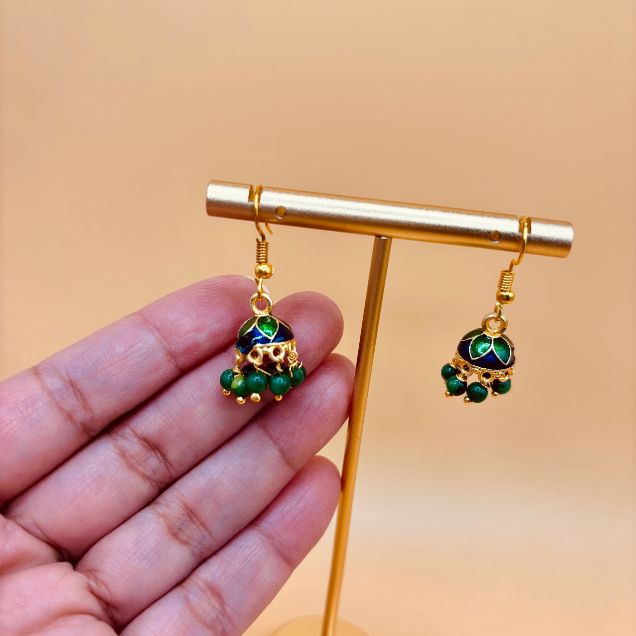 • Clothing: Embroidered/Printed suit for women - Made of best quality fabric - lawn or linen or chiffon - pure silk - Available at Najma Designs & Co. • Jewelry: Gold - plated stud earrings for