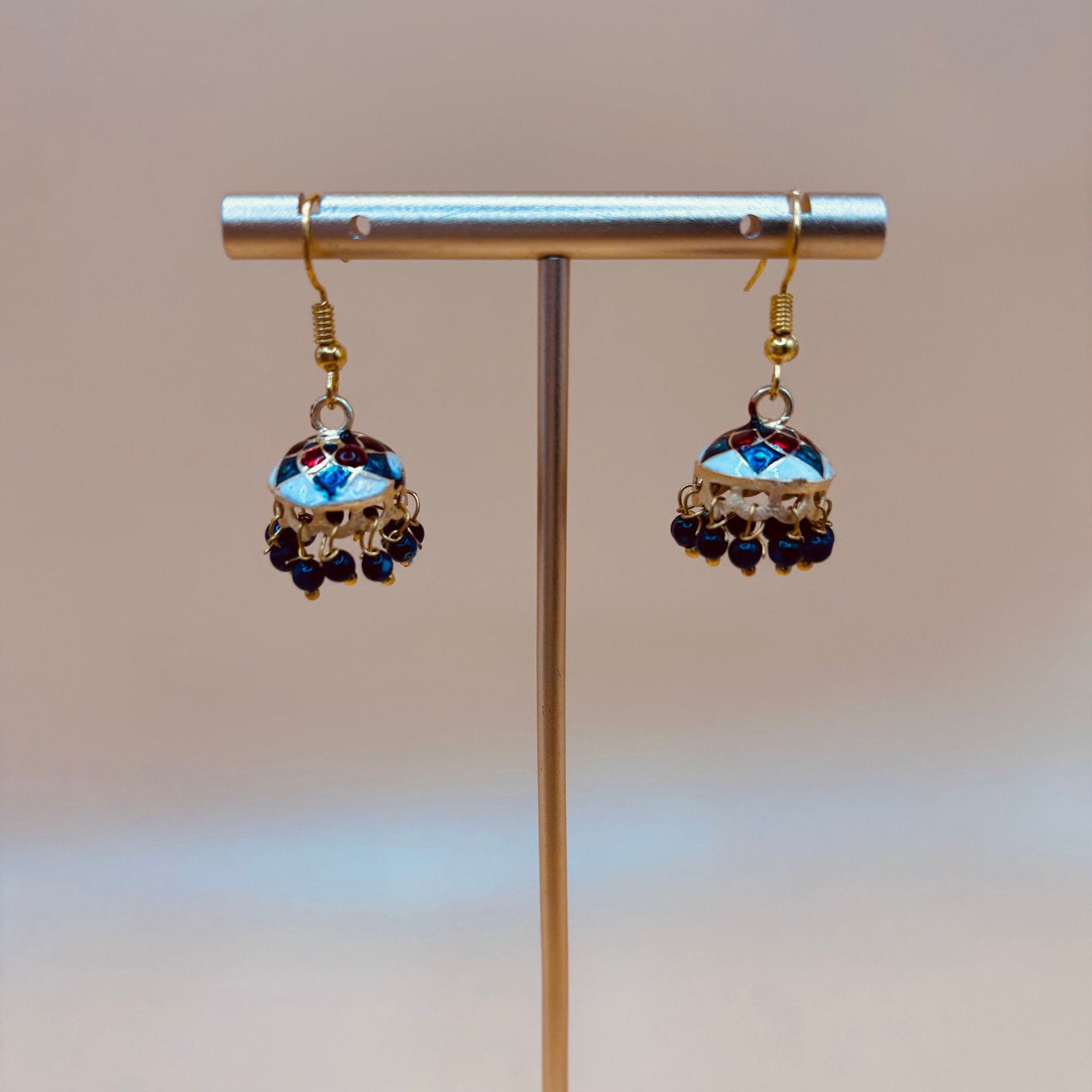 • Clothing: Embroidered/Printed suit for women - Made of best quality fabric - lawn or linen or chiffon - pure silk - Available at Najma Designs & Co. • Jewelry: Gold - plated stud earrings for