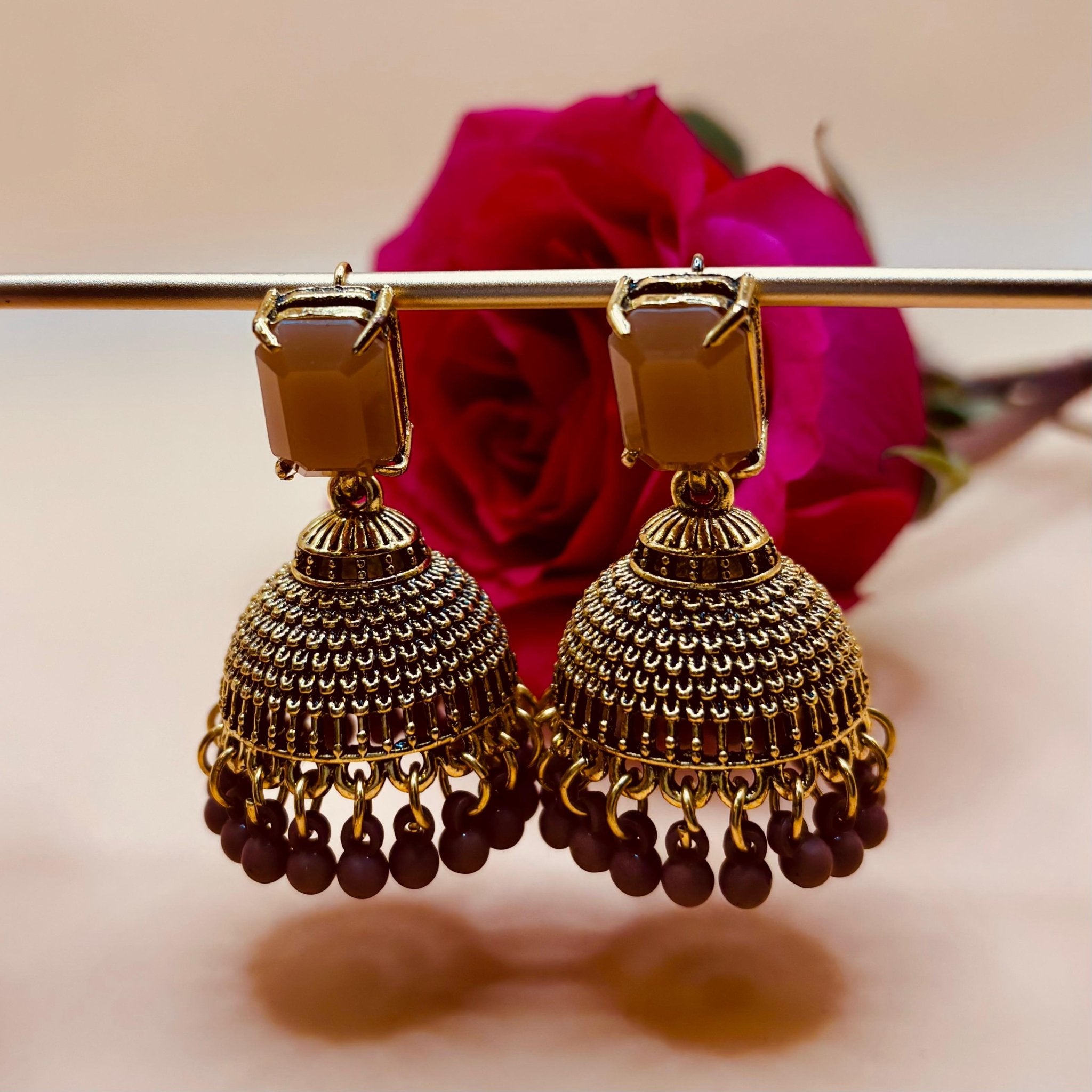 • Clothing: Embroidered/Printed suit for women - Made of best quality fabric - lawn or linen or chiffon - pure silk - Available at Najma Designs & Co. • Jewelry: Gold - plated stud earrings for