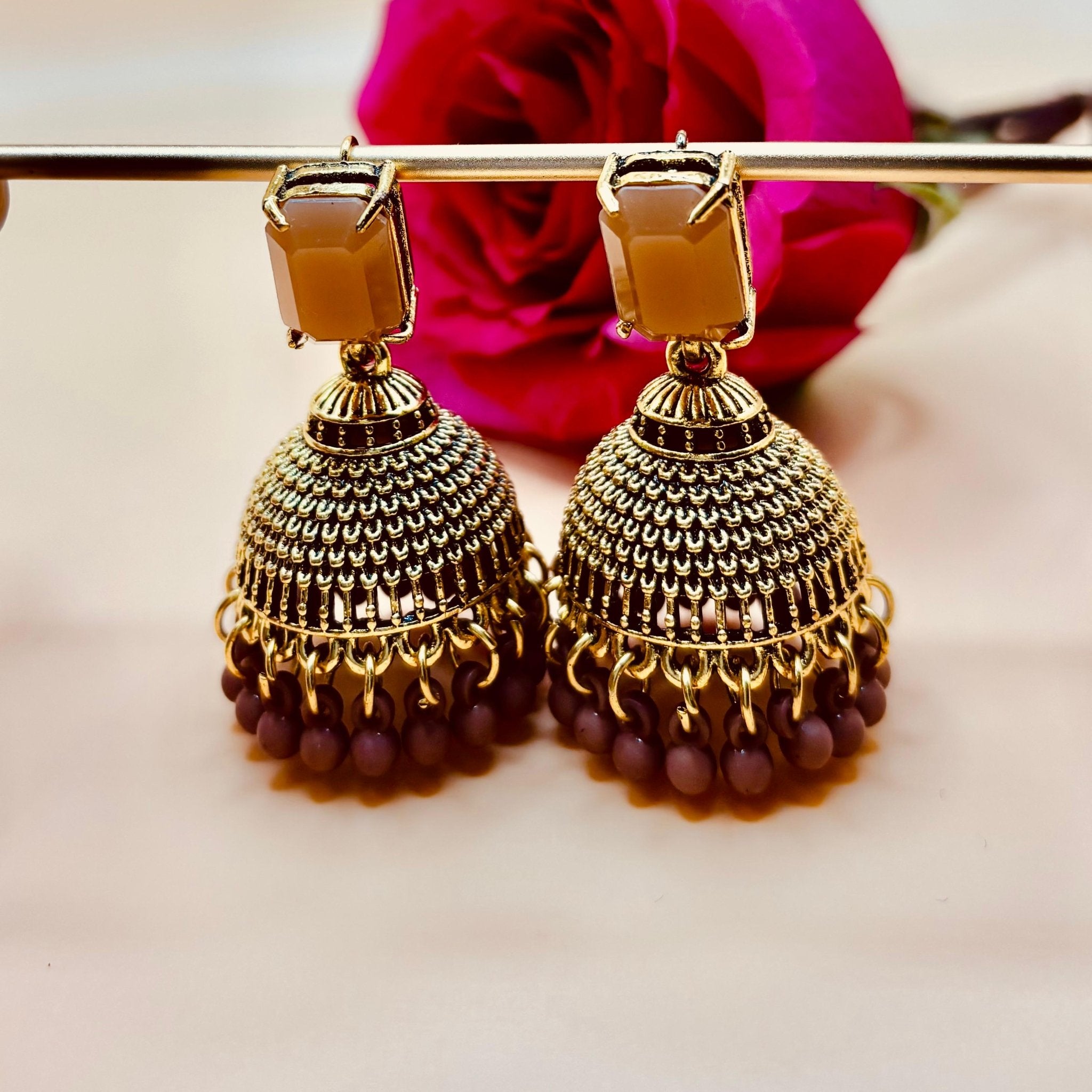 • Clothing: Embroidered/Printed suit for women - Made of best quality fabric - lawn or linen or chiffon - pure silk - Available at Najma Designs & Co. • Jewelry: Gold - plated stud earrings for