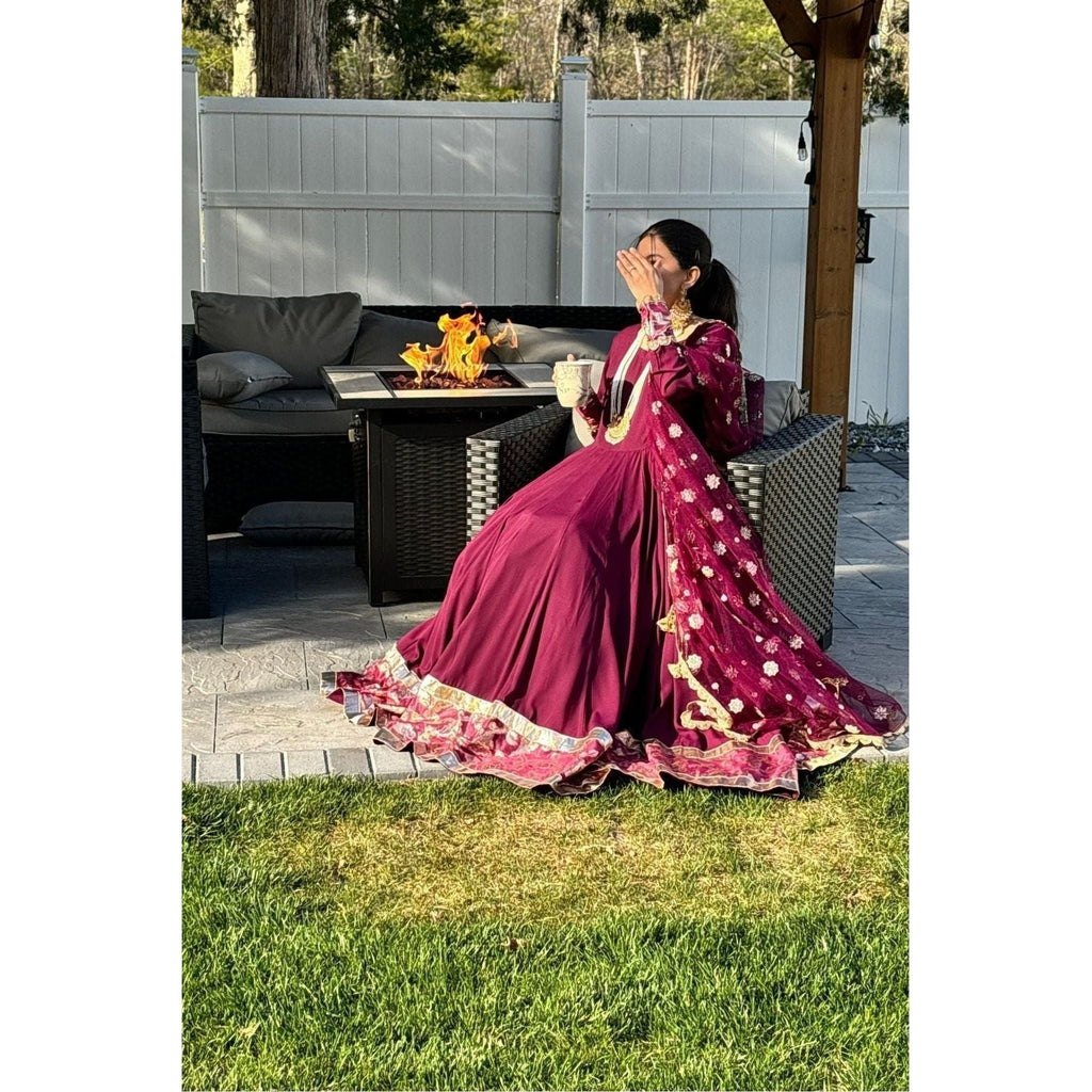 Formal gown in melberry color, net dupatta with Banarasi border. 