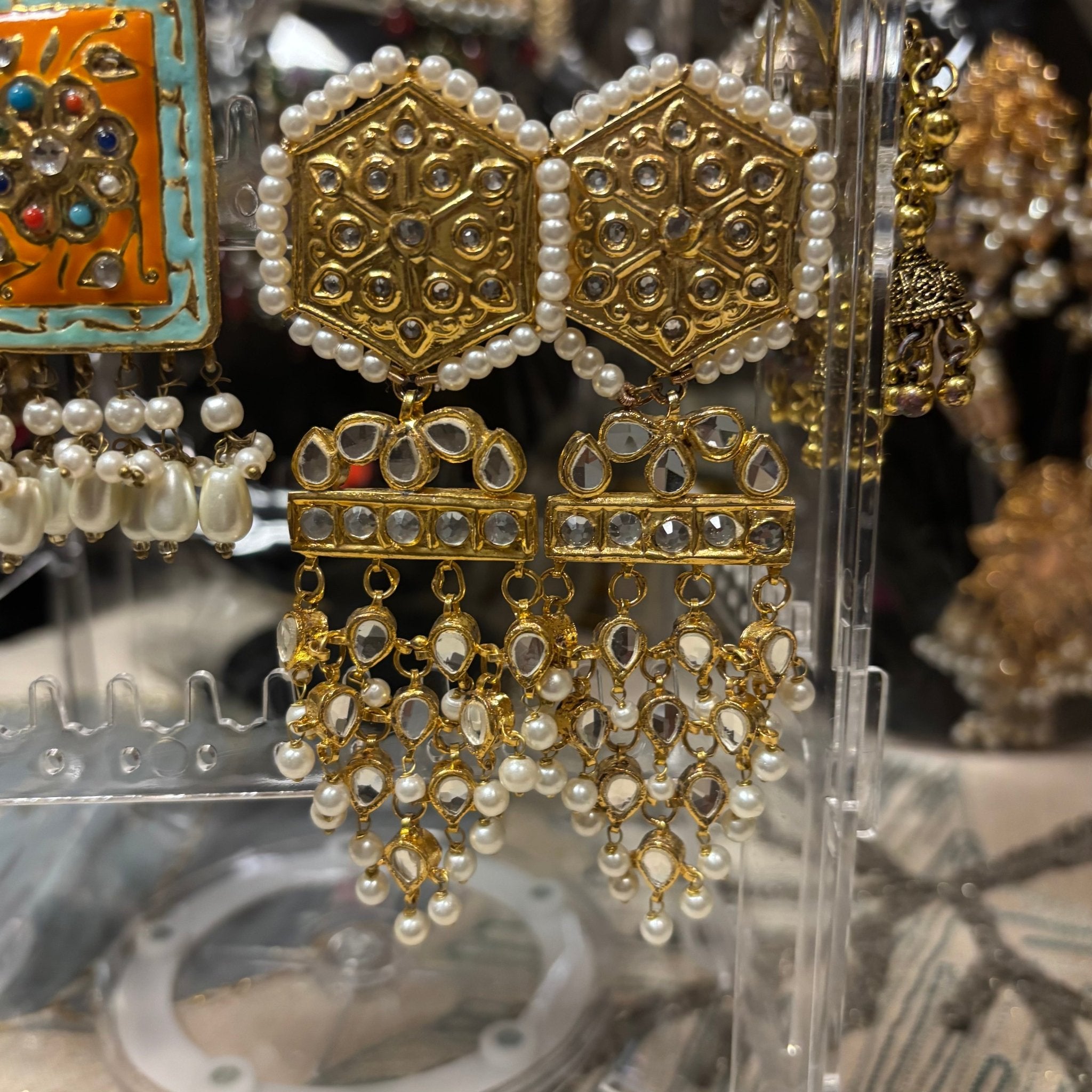 • Clothing: Embroidered/Printed suit for women - Made of best quality fabric - lawn or linen or chiffon - pure silk - Available at Najma Designs & Co. • Jewelry: Gold - plated stud earrings for