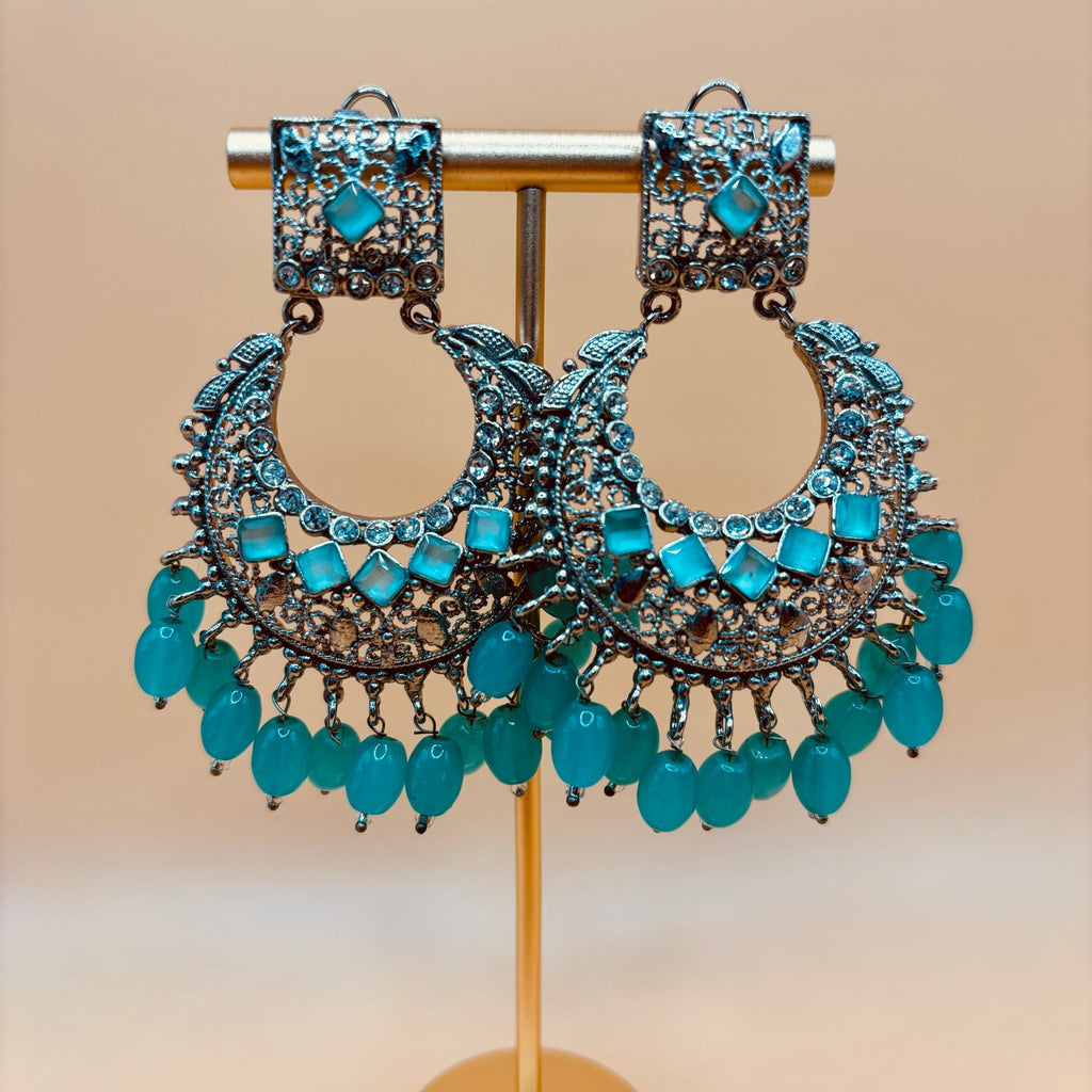 • Clothing: Embroidered/Printed suit for women - Made of best quality fabric - lawn or linen or chiffon - pure silk - Available at Najma Designs & Co. • Jewelry: Gold - plated stud earrings for