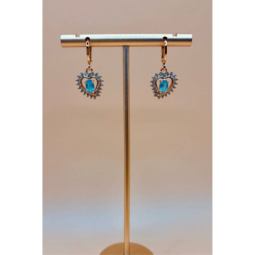 These Ocean Heart Earrings feature a beautiful rhinestone heart shape design, adorned with sparkling crystals. Made with high-quality materials and finished with a 1 carat gold plating, these elegant earrings are sure to elevate any outfit. Dangle them for a touch of sophistication and style.