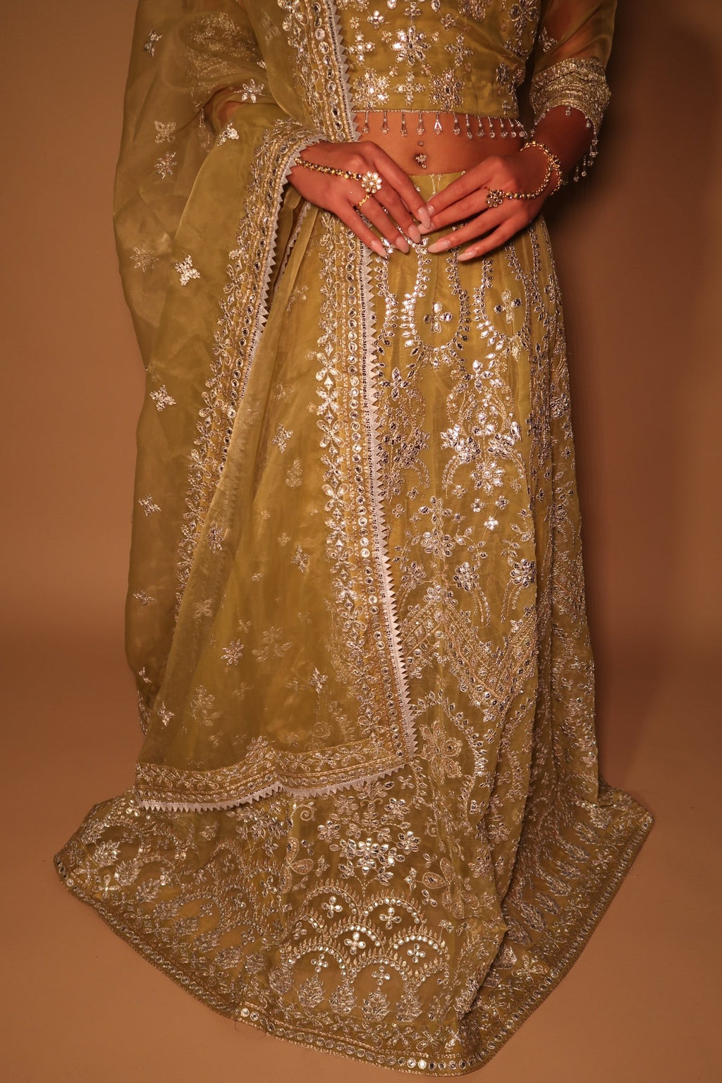 • Clothing: Embroidered/Printed suit for women - Made of best quality fabric - lawn or linen or chiffon- pure silk - Available at Najma Designs & Co. • Jewelry: Gold-plated stud earrings for