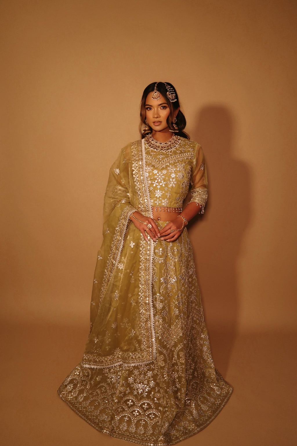 • Clothing: Embroidered/Printed suit for women - Made of best quality fabric - lawn or linen or chiffon- pure silk - Available at Najma Designs & Co. • Jewelry: Gold-plated stud earrings for