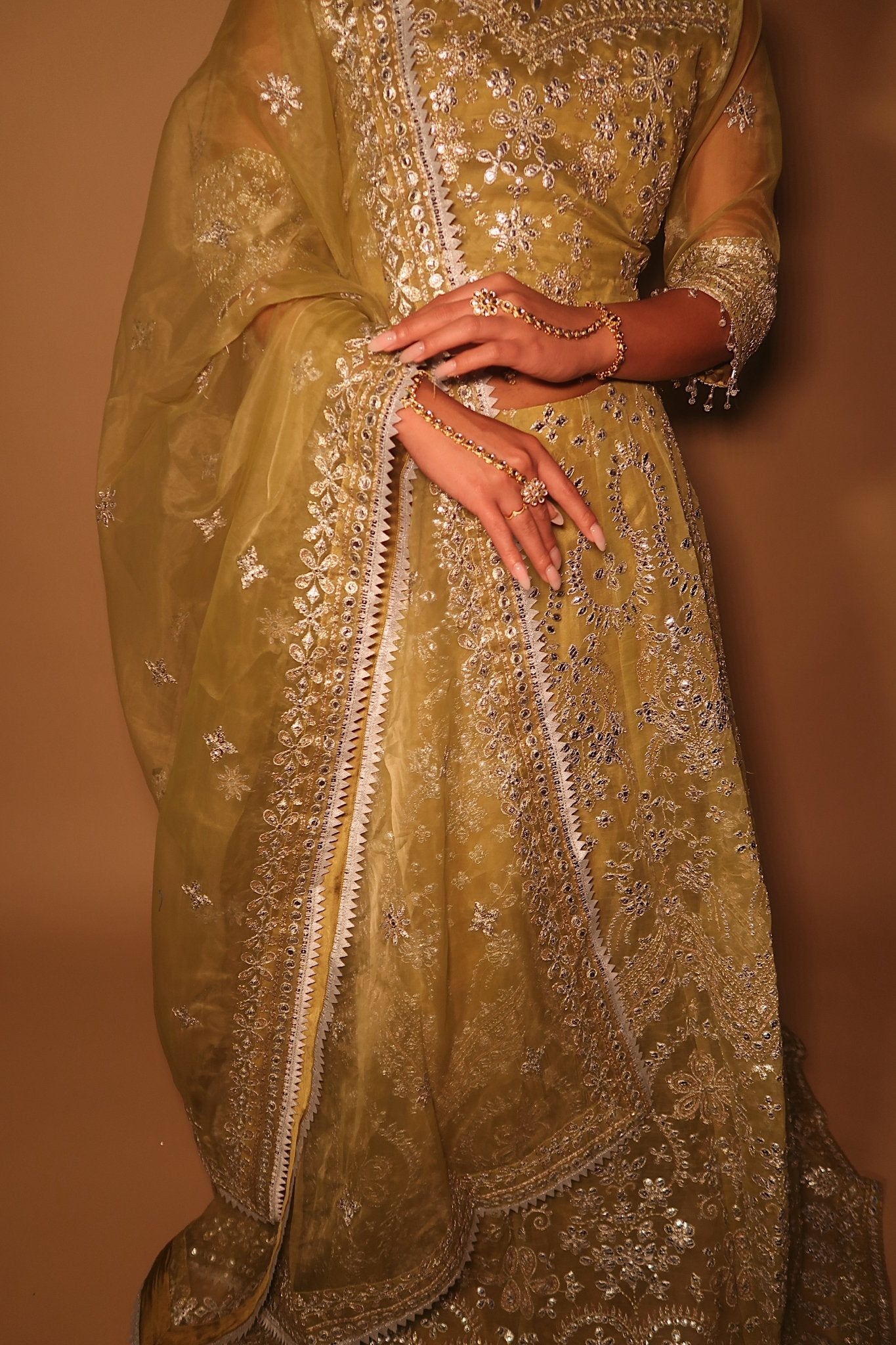 • Clothing: Embroidered/Printed suit for women - Made of best quality fabric - lawn or linen or chiffon- pure silk - Available at Najma Designs & Co. • Jewelry: Gold-plated stud earrings for