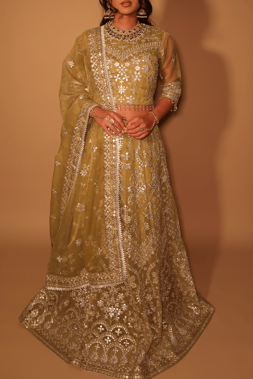 • Clothing: Embroidered/Printed suit for women - Made of best quality fabric - lawn or linen or chiffon- pure silk - Available at Najma Designs & Co. • Jewelry: Gold-plated stud earrings for