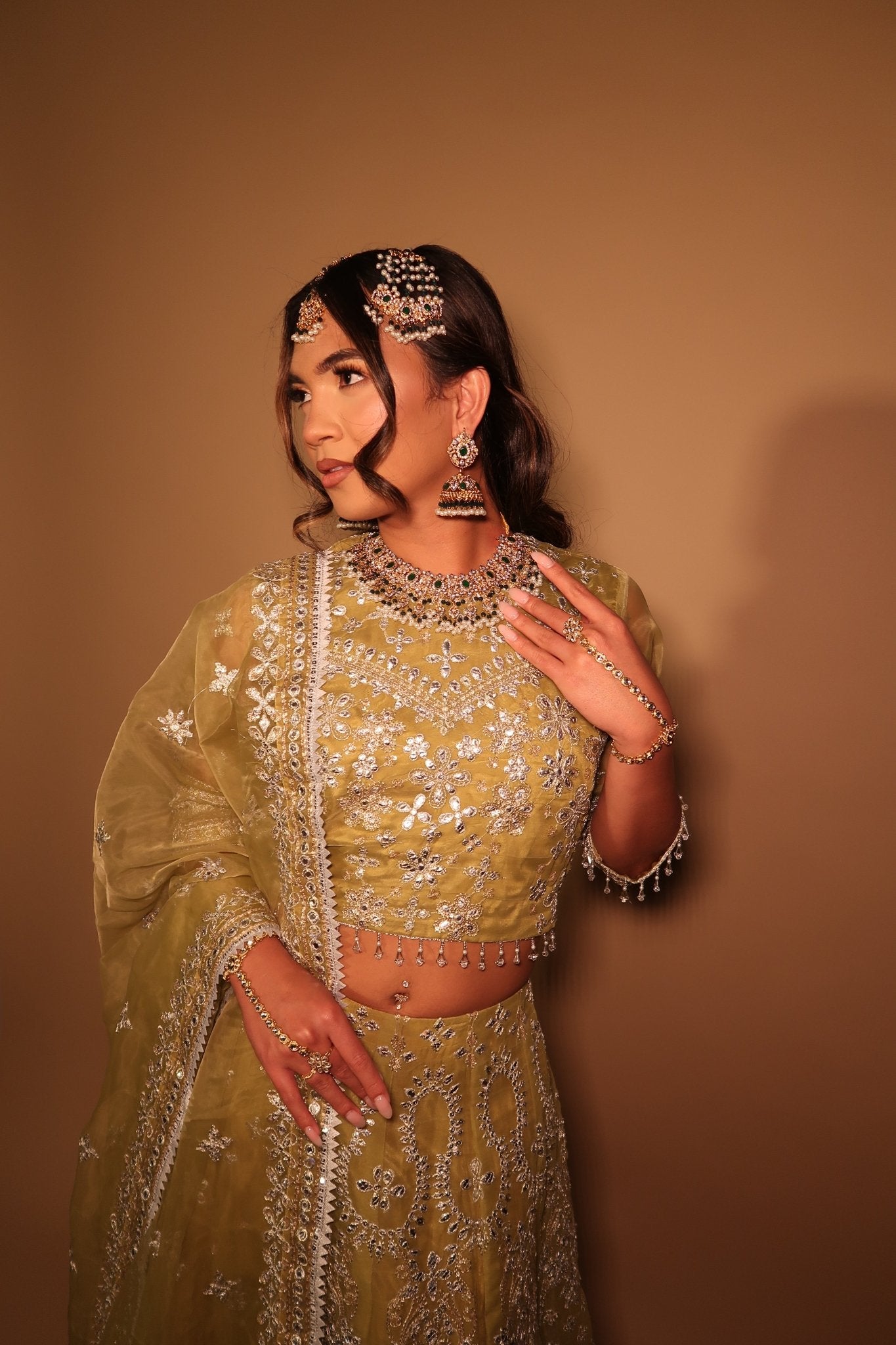 • Clothing: Embroidered/Printed suit for women - Made of best quality fabric - lawn or linen or chiffon- pure silk - Available at Najma Designs & Co. • Jewelry: Gold-plated stud earrings for