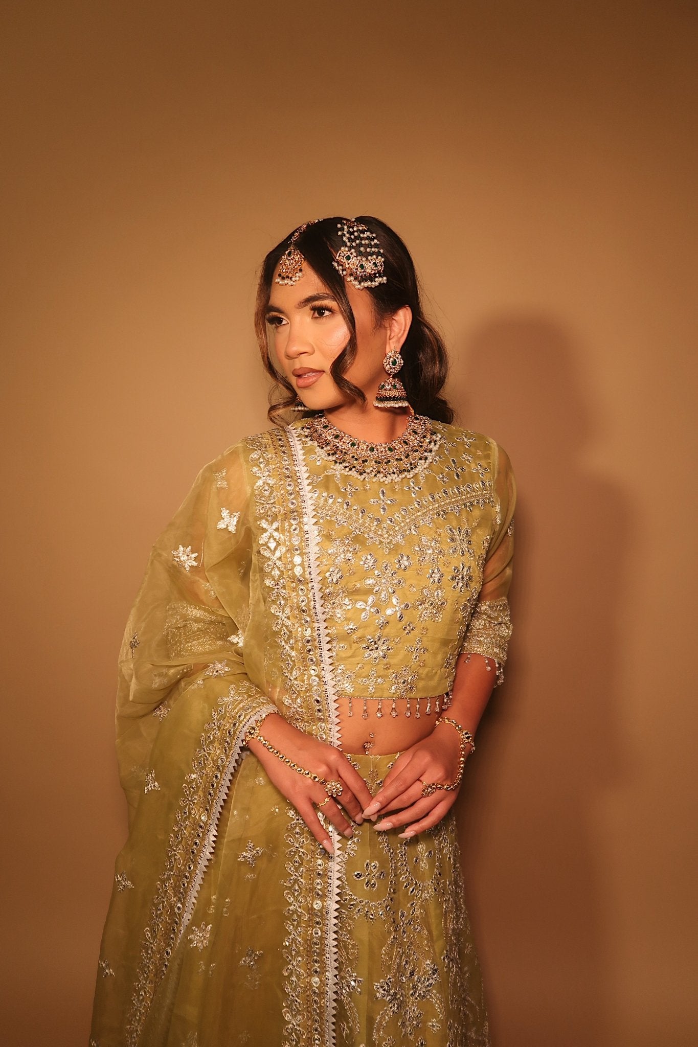 • Clothing: Embroidered/Printed suit for women - Made of best quality fabric - lawn or linen or chiffon- pure silk - Available at Najma Designs & Co. • Jewelry: Gold-plated stud earrings for