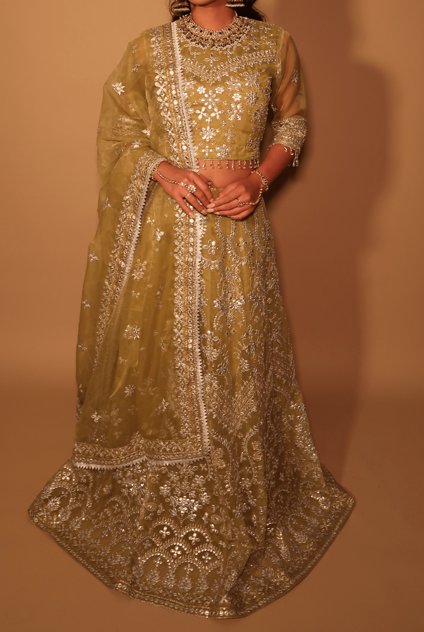 • Clothing: Embroidered/Printed suit for women - Made of best quality fabric - lawn or linen or chiffon- pure silk - Available at Najma Designs & Co. • Jewelry: Gold-plated stud earrings for