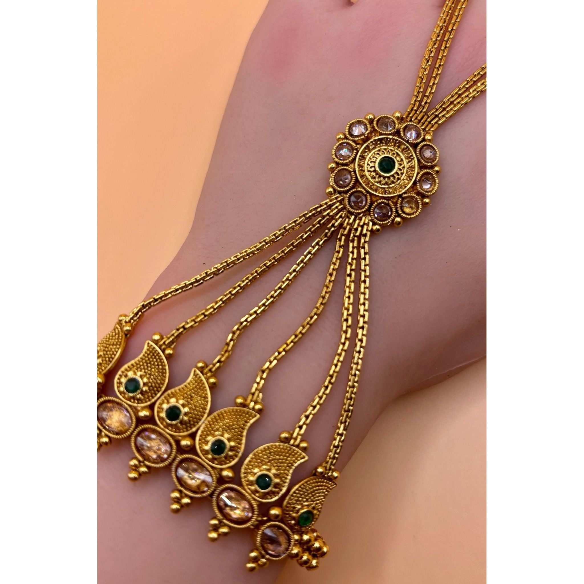This elegant hand bracelet and ring set is crafted with premium quality brass and features a luxurious gold plating. Its exquisite design and high-quality materials make it a perfect addition to any jewelry collection. Upgrade your style with this premium hand bracelet and ring set today.&nbsp;