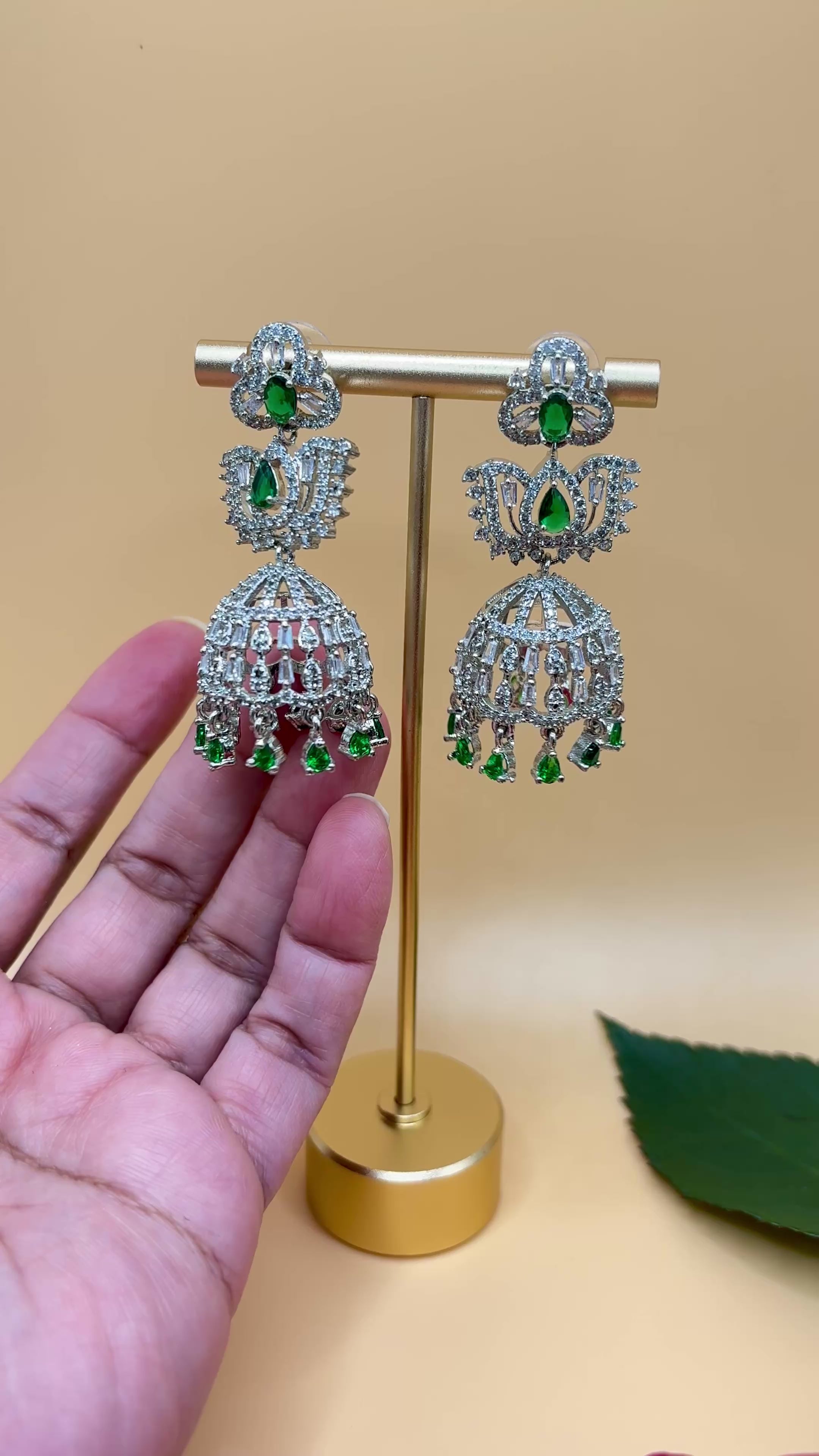 Silver Radiance Emerald Jhumkas