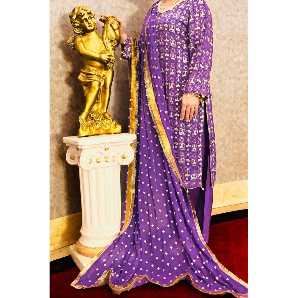 close up of Purple chiffon suit with silver embroidery and a chiffon embroidered dupatta is perfect for both formal and party wear. The neckline is adorned with pearl work. 