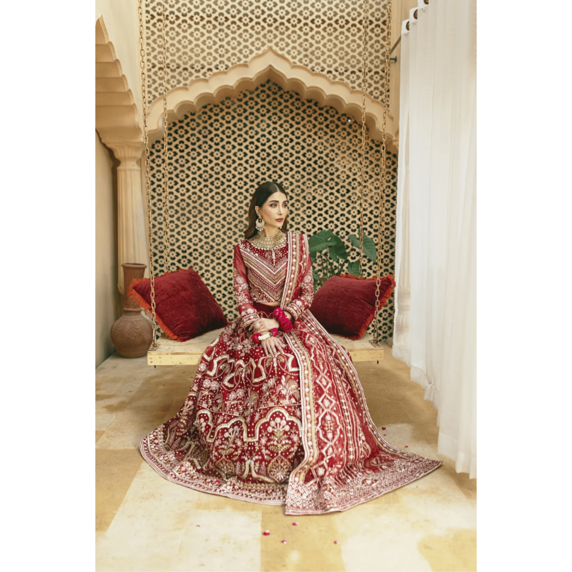 Stitched Two-Tone Red Lehnga with Antique Gold Embellishments, Ornate Design on Panels, Sleeves, Bodice, and Neckline, Unique Bronze 'Panni' Dupatta with Silver Jamawar Borders, Organza Fabric, Luxe and Grand Statement Piece