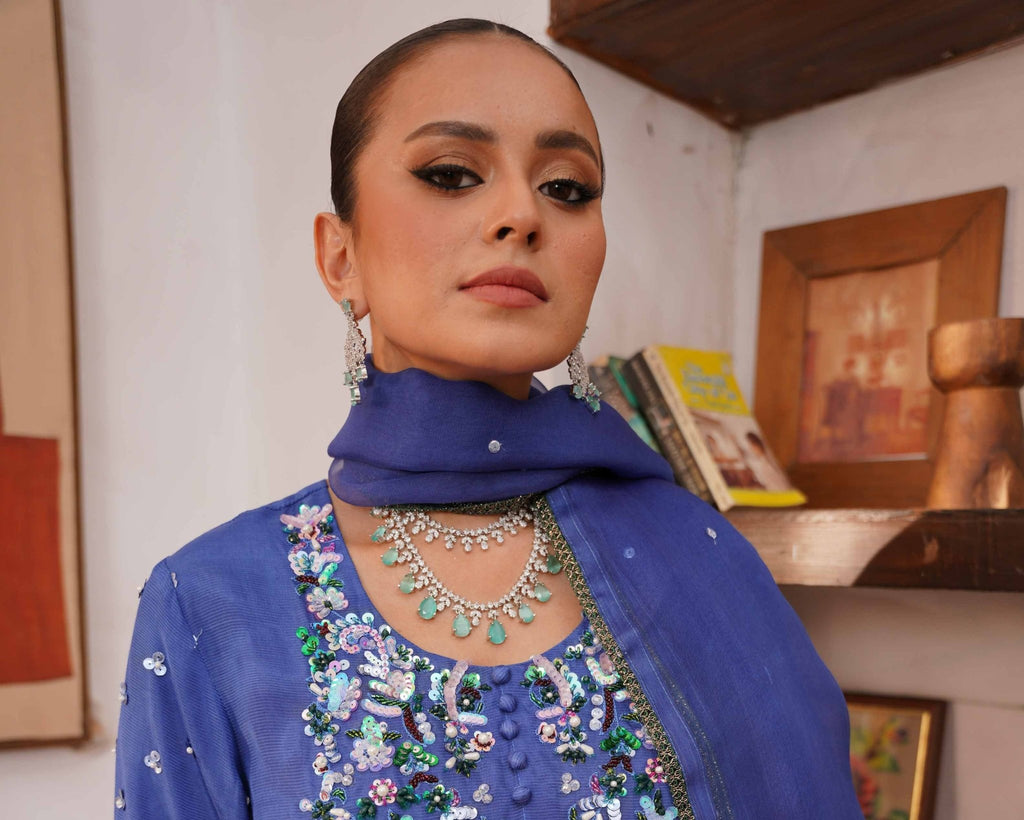 • Clothing: Embroidered/Printed suit for women - Made of best quality fabric - lawn or linen or chiffon - pure silk - Available at Najma Designs & Co. • Jewelry: Gold - plated stud earrings for