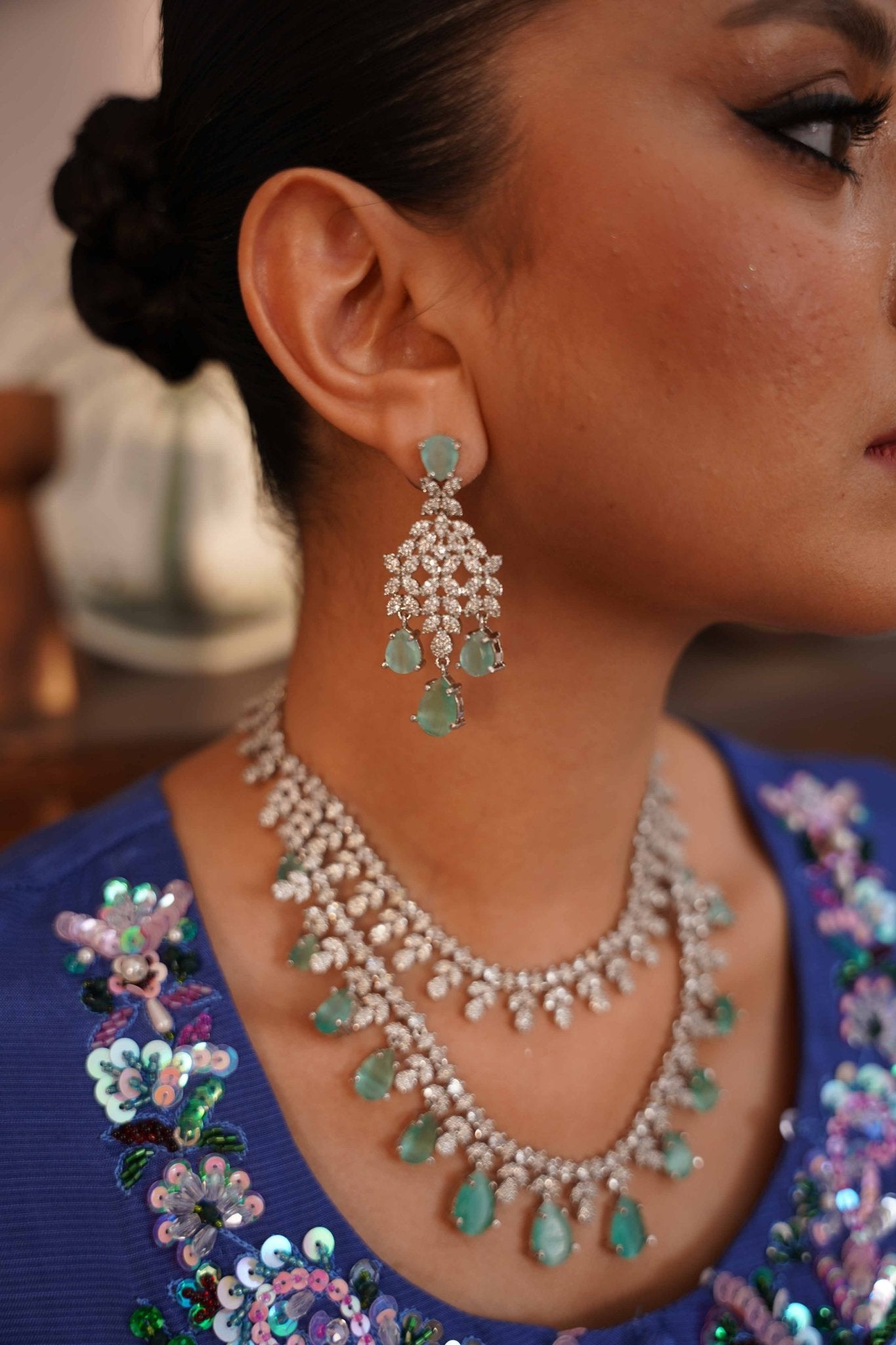 • Clothing: Embroidered/Printed suit for women - Made of best quality fabric - lawn or linen or chiffon - pure silk - Available at Najma Designs & Co. • Jewelry: Gold - plated stud earrings for