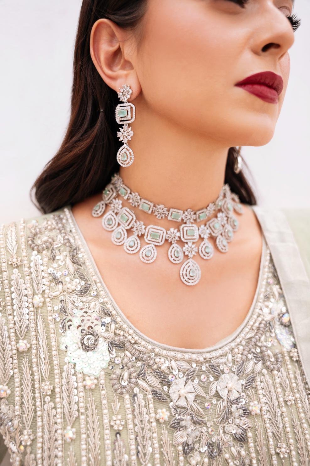 • Clothing: Embroidered/Printed suit for women - Made of best quality fabric - lawn or linen or chiffon - pure silk - Available at Najma Designs & Co. • Jewelry: Gold - plated stud earrings for