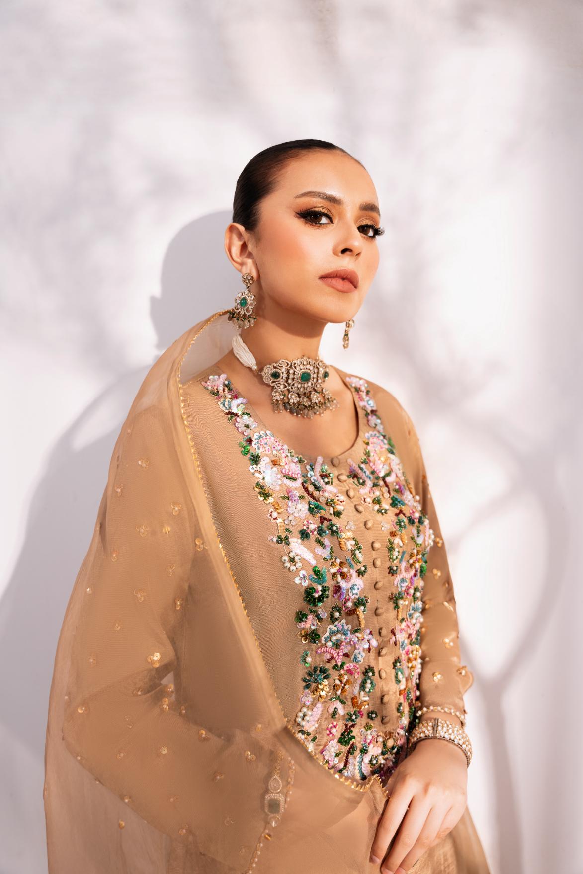 • Clothing: Embroidered/Printed suit for women - Made of best quality fabric - lawn or linen or chiffon - pure silk - Available at Najma Designs & Co. • Jewelry: Gold - plated stud earrings for