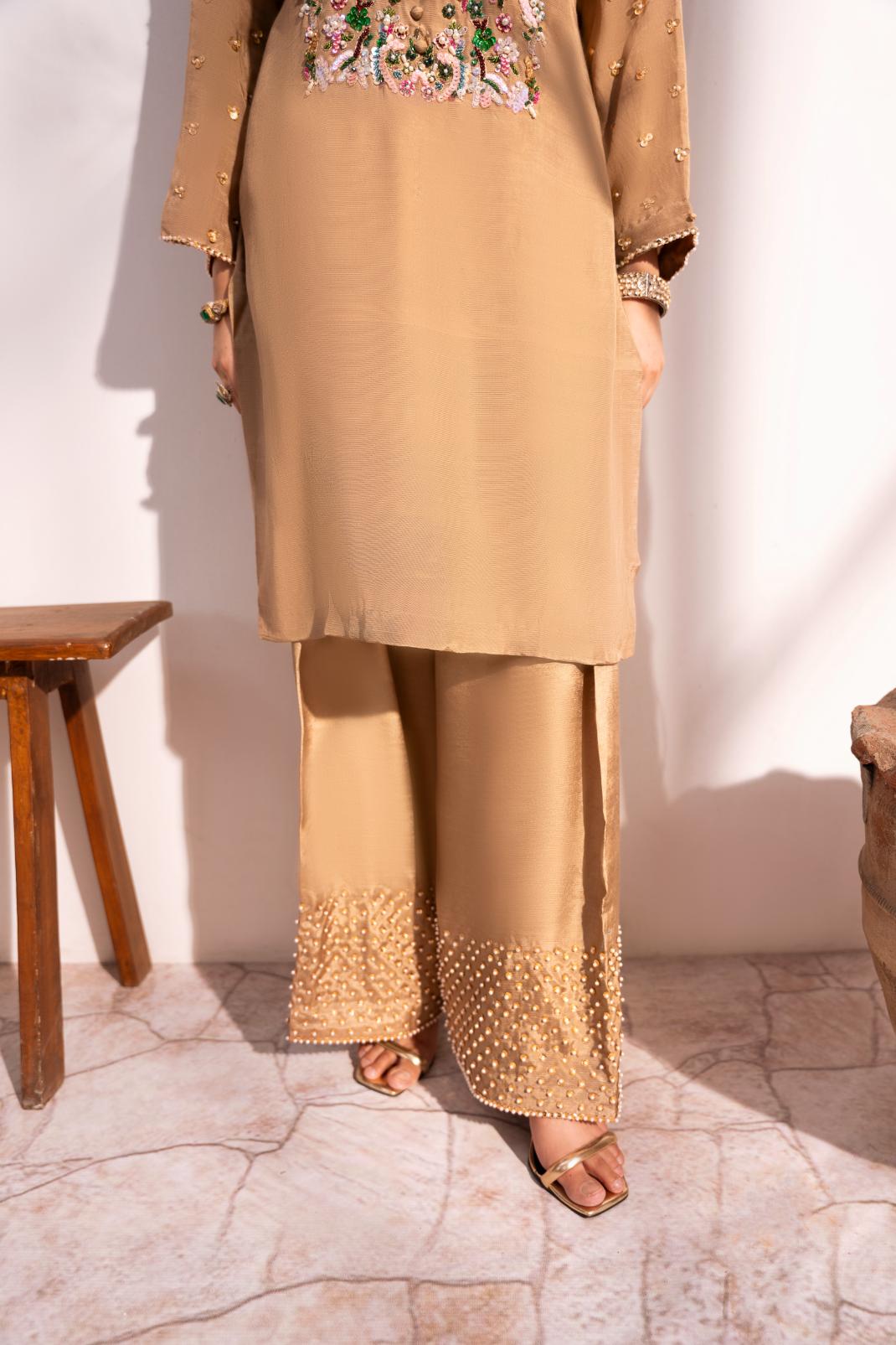• Clothing: Embroidered/Printed suit for women - Made of best quality fabric - lawn or linen or chiffon - pure silk - Available at Najma Designs & Co. • Jewelry: Gold - plated stud earrings for