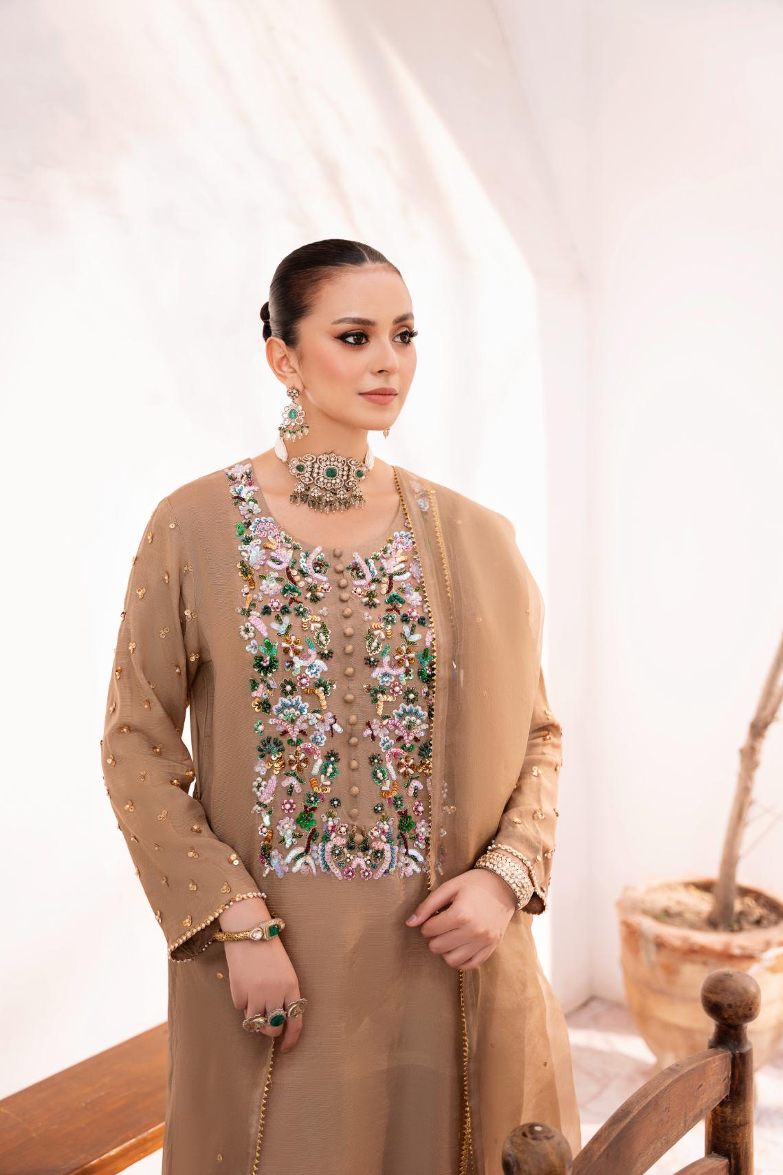 • Clothing: Embroidered/Printed suit for women - Made of best quality fabric - lawn or linen or chiffon - pure silk - Available at Najma Designs & Co. • Jewelry: Gold - plated stud earrings for