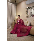 Stitched Sari comes with attached sleeves embroidered with sequince work in the majenta color. Made in Pakistan, it’s available for purchase at najmaDesigns and co.