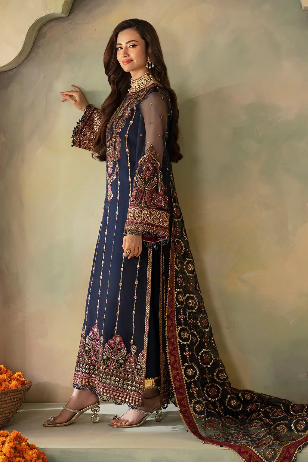 • Clothing: Embroidered/Printed suit for women - Made of best quality fabric - lawn or linen or chiffon- pure silk - Available at Najma Designs & Co. • Jewelry: Gold-plated stud earrings for