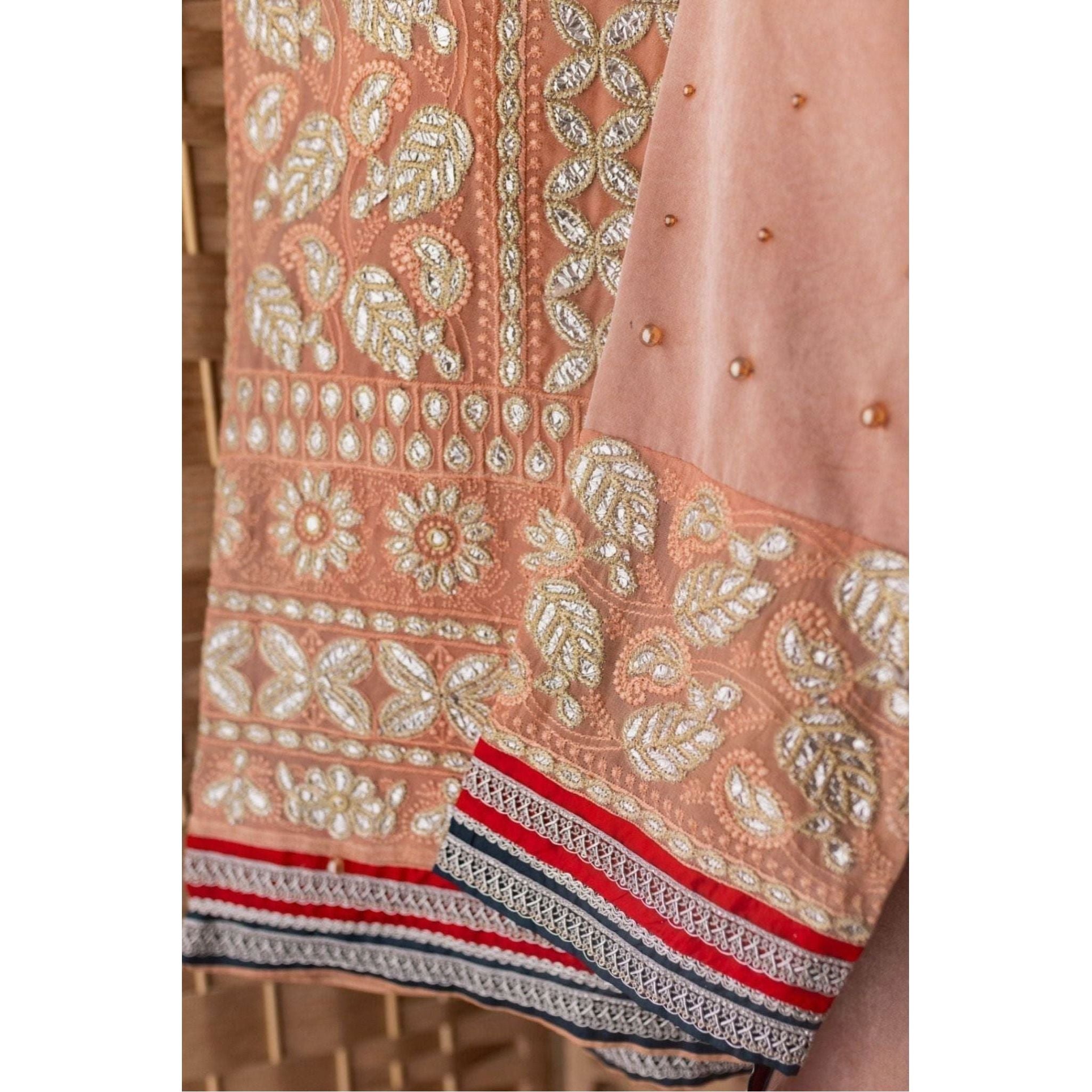 Chicken Karri Shalwar and dupatta with Silk and Moti Work with tilla Lace.
outfit color is Peach color 