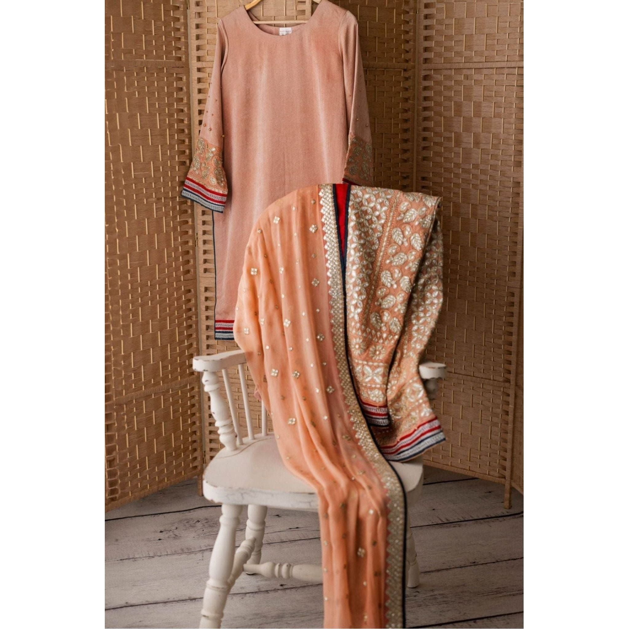 Chicken Karri Shalwar and dupatta with Silk and Moti Work with tilla Lace.
outfit color is Peach color 