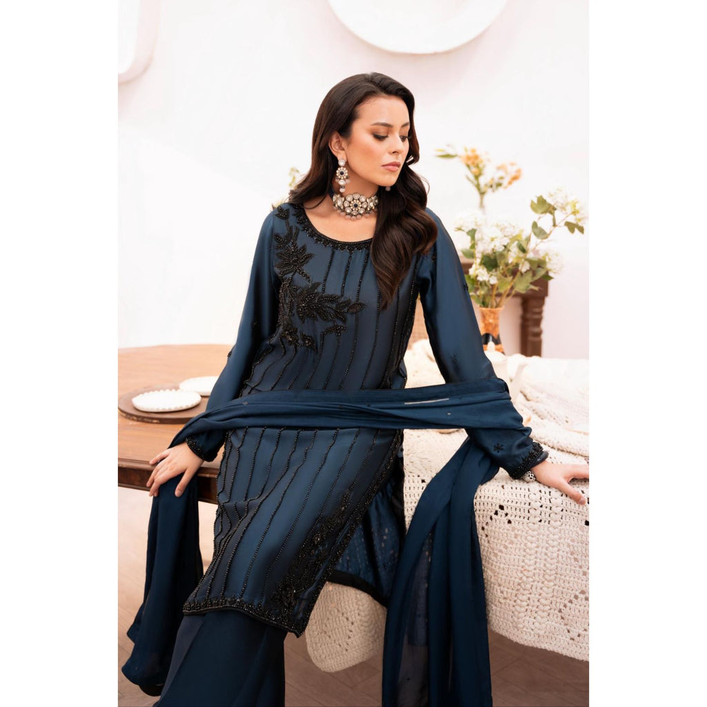 • Clothing: Embroidered/Printed suit for women - Made of best quality fabric - lawn or linen or chiffon - pure silk - Available at Najma Designs & Co. • Jewelry: Gold - plated stud earrings for