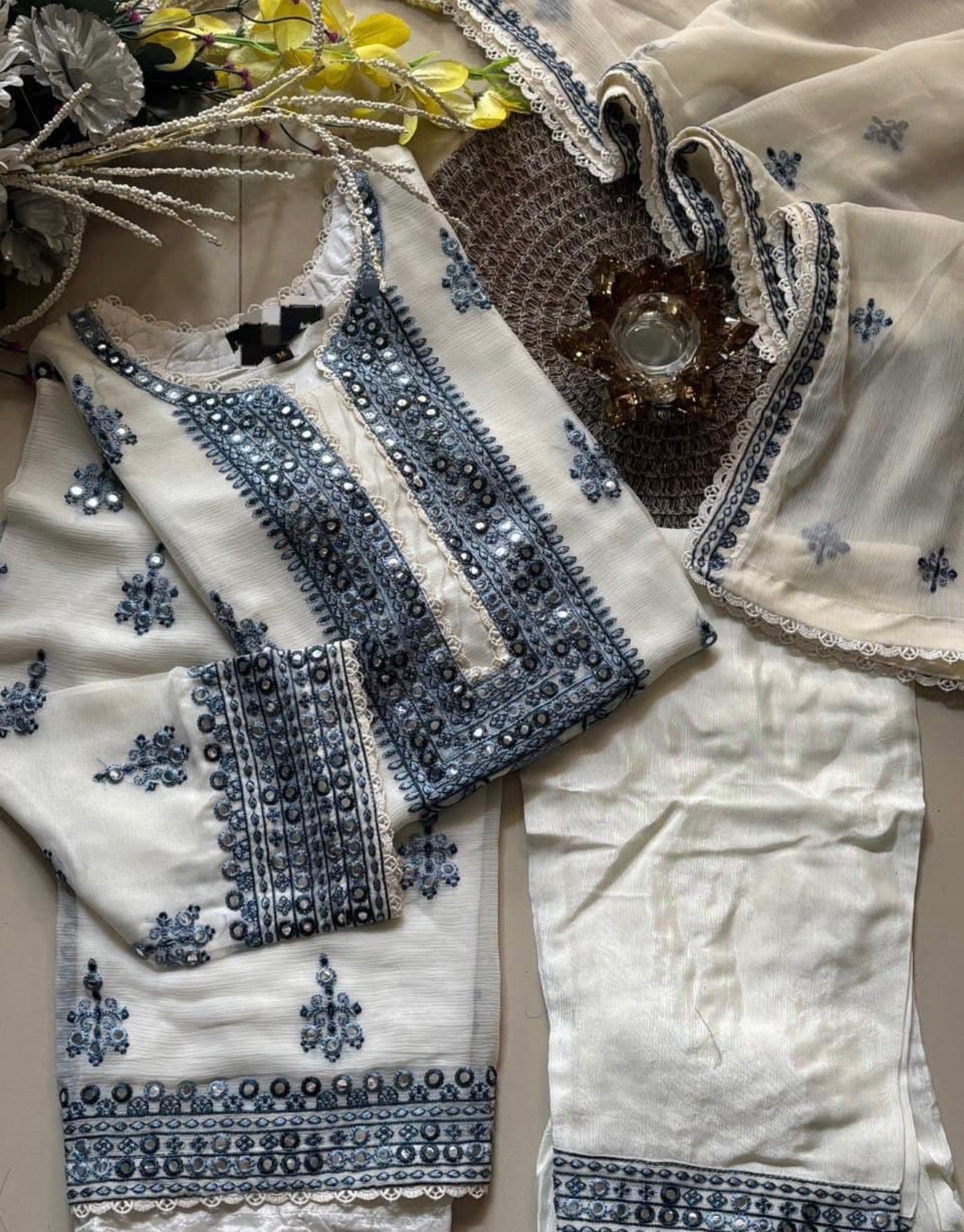 • Clothing: Embroidered/Printed suit for women - Made of best quality fabric - lawn or linen or chiffon - pure silk - Available at Najma Designs & Co. • Jewelry: Gold - plated stud earrings for