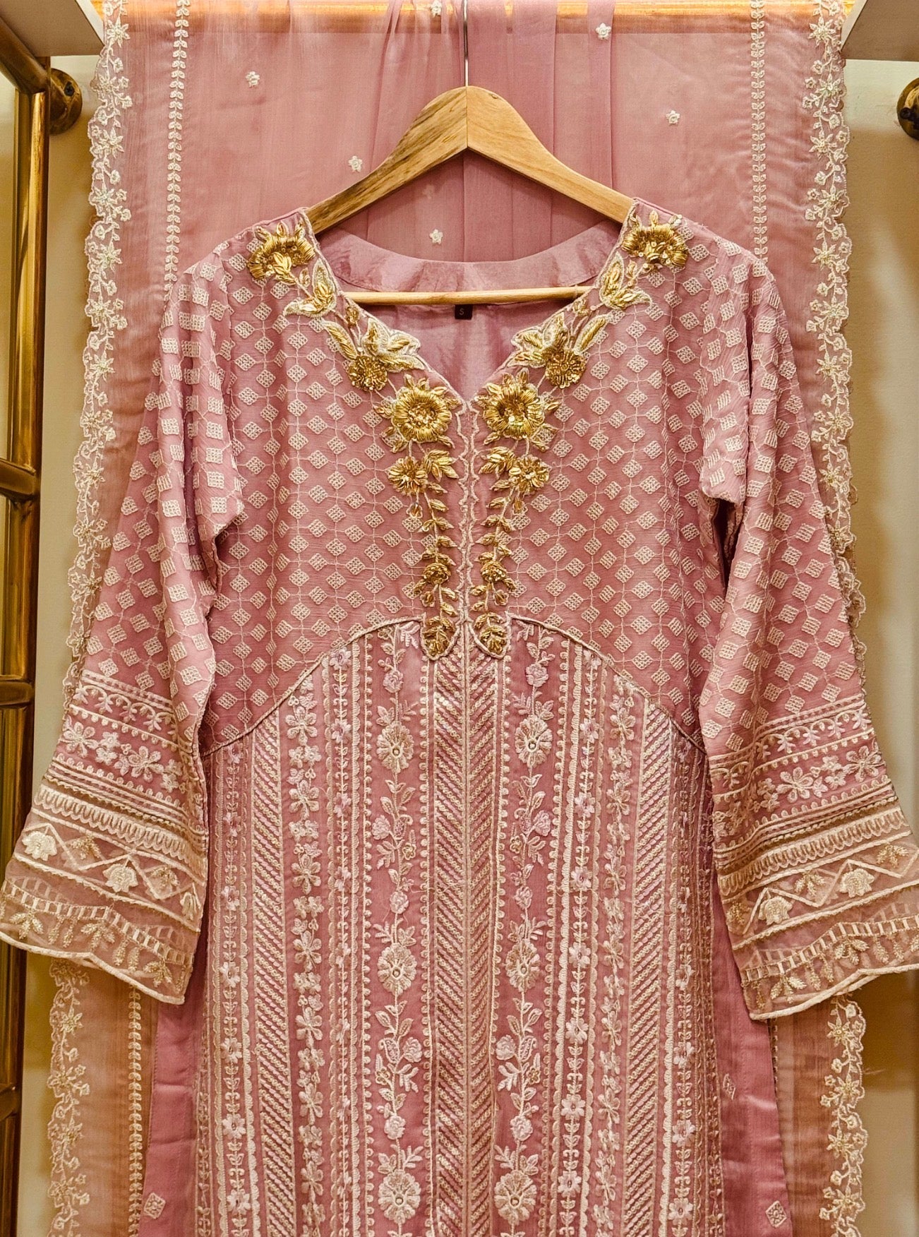 • Clothing: Embroidered/Printed suit for women - Made of best quality fabric - lawn or linen or chiffon - pure silk - Available at Najma Designs & Co. • Jewelry: Gold - plated stud earrings for