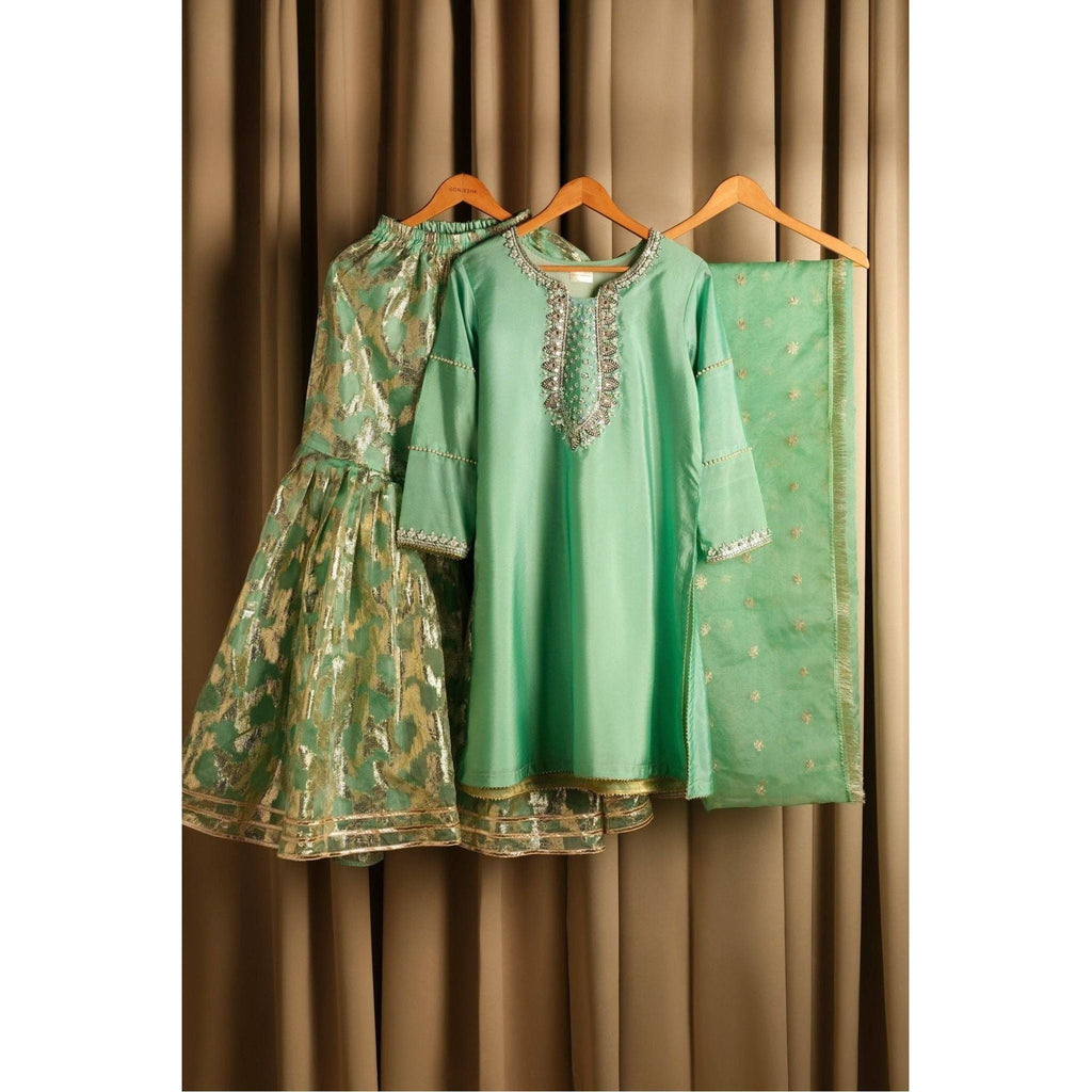 	•	Product Description: Beautiful raw silk sharara suit with silver hand embroidery.
	•	Color: Light pastel green.
