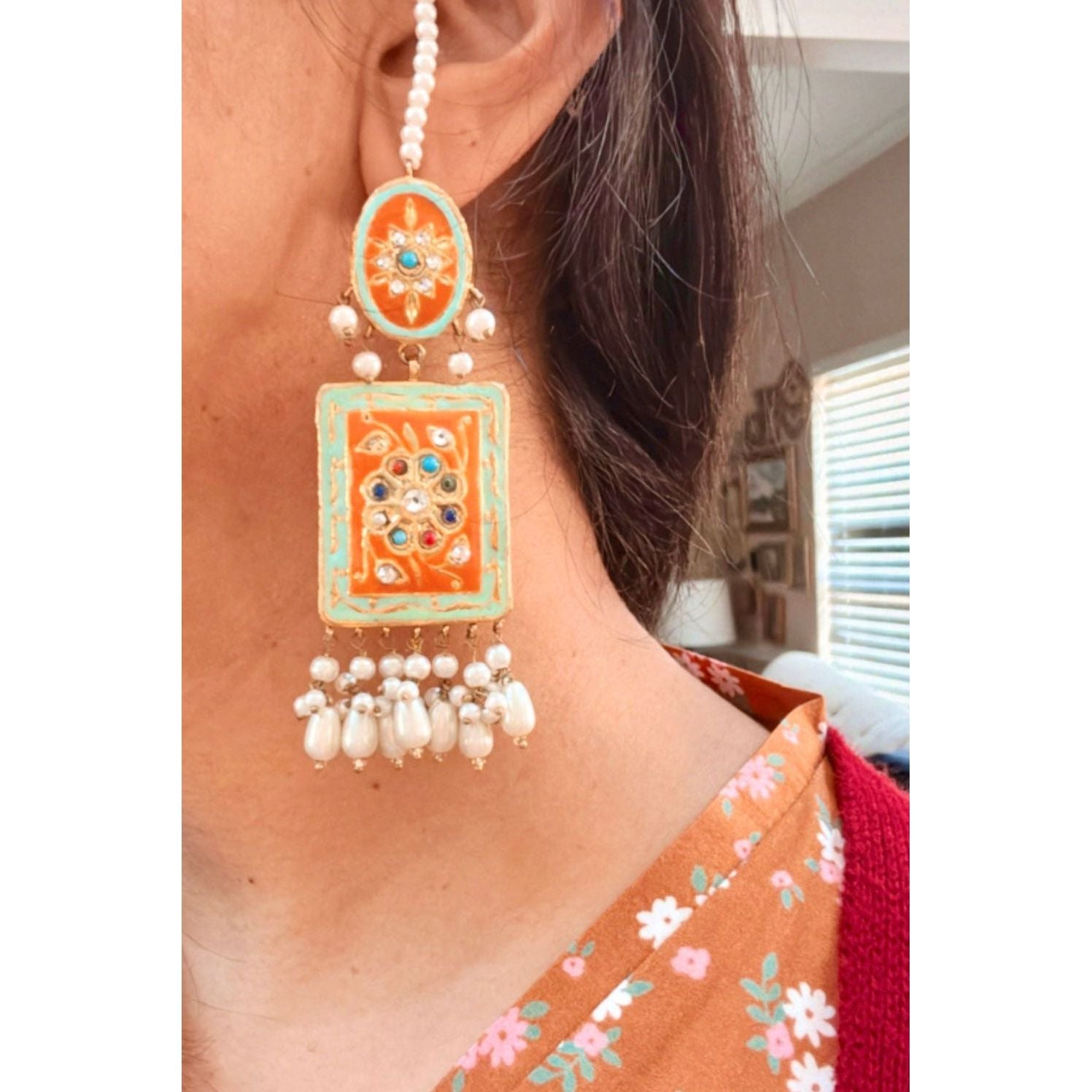 model wearing the earrings 
