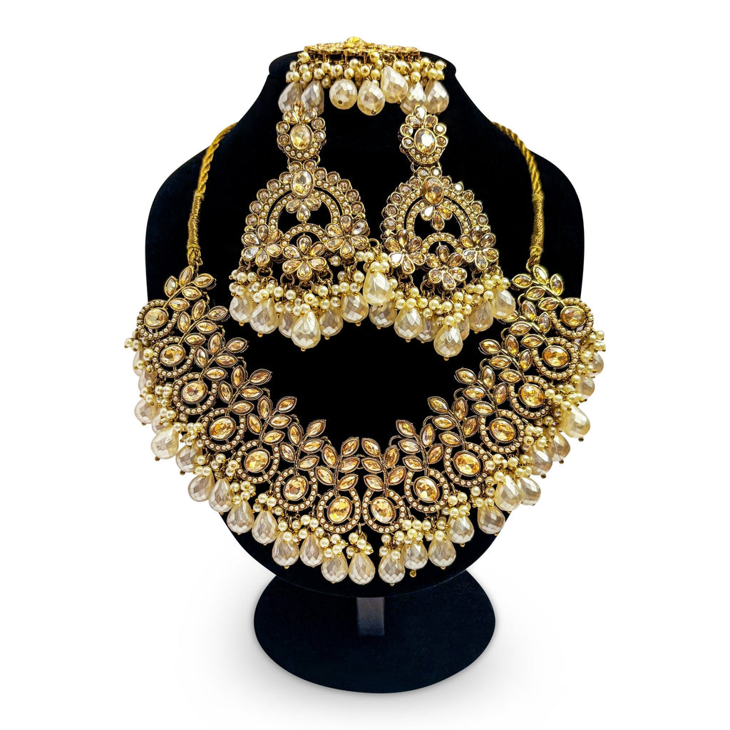 • Clothing: Embroidered/Printed suit for women - Made of best quality fabric - lawn or linen or chiffon - pure silk - Available at Najma Designs & Co. • Jewelry: Gold - plated stud earrings for