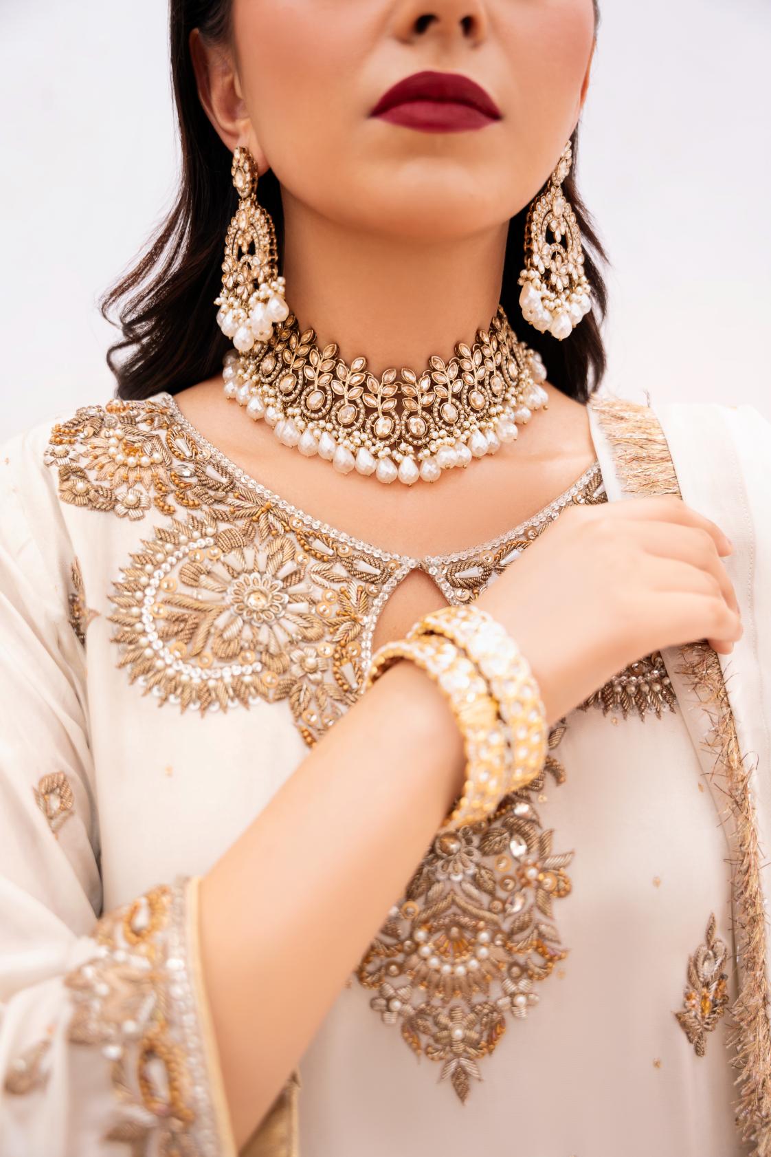 • Clothing: Embroidered/Printed suit for women - Made of best quality fabric - lawn or linen or chiffon - pure silk - Available at Najma Designs & Co. • Jewelry: Gold - plated stud earrings for