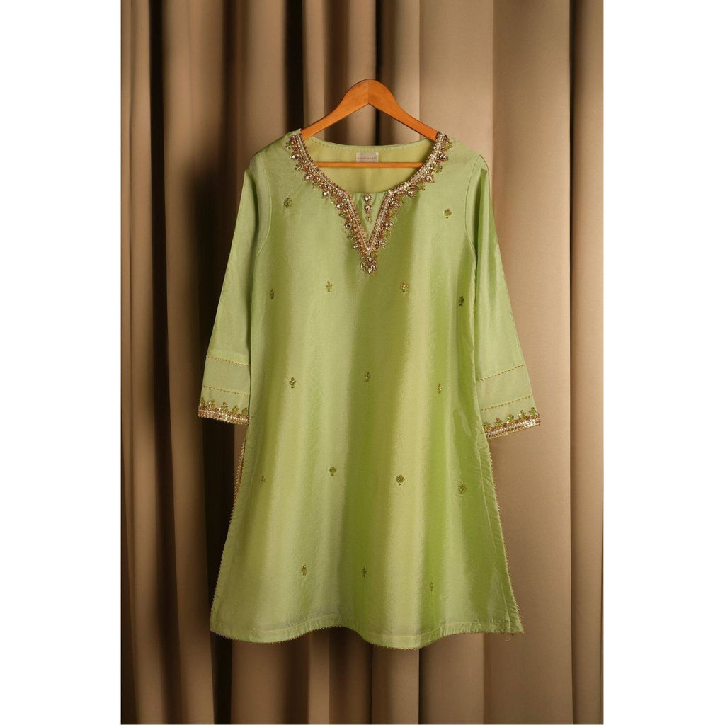 Product Description: Beautiful raw silk Gharara suit with gold hand embroidery with crystals Color: Lime green.
